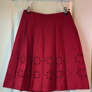 Loft red cutout design skirt. Size 00 petite . Excellent condition.